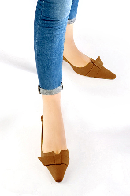 Women's caramel brown elegant slingback heels, with a bow on the front. Tapered toe. Medium spool heels - Worn view